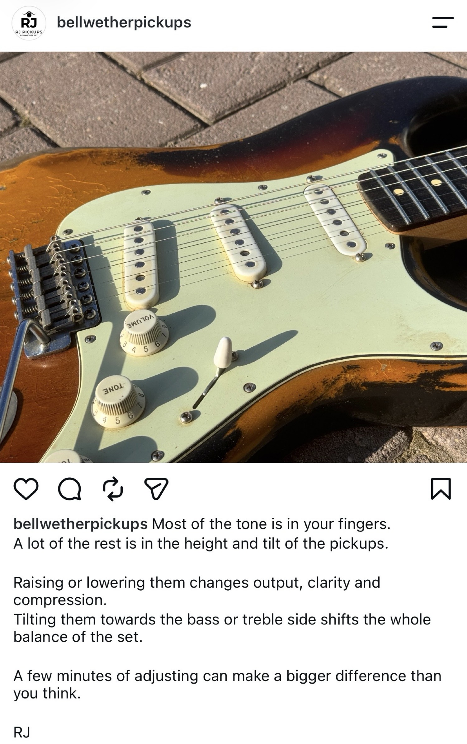 Screwdriver resting on an aged Stratocaster next to Bellwether pickups
