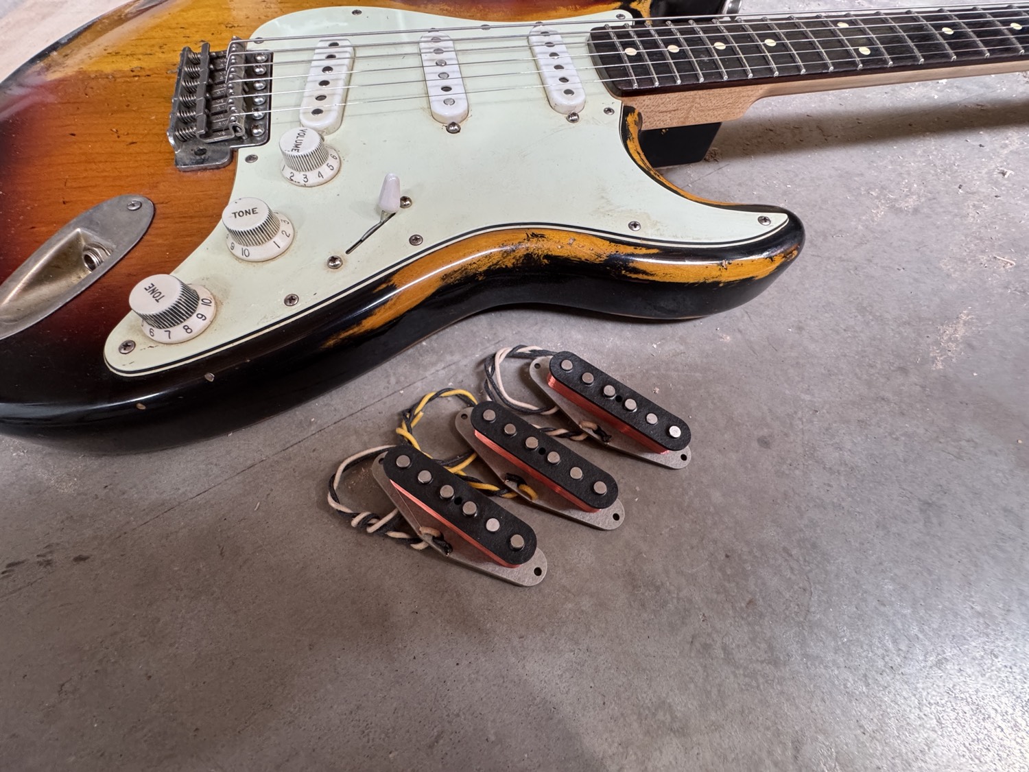 Three Bellwether pickups mounted in a Stratocaster pickguard